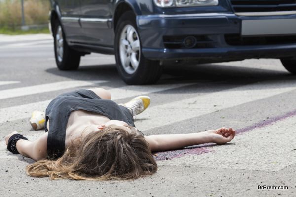 Dead woman lying on a street