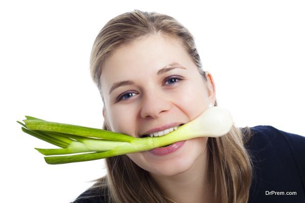 Woman enjoying fresh spring onion