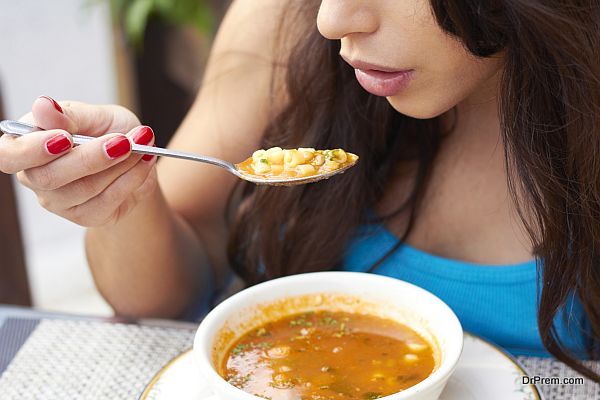 Woman Eating Soup
